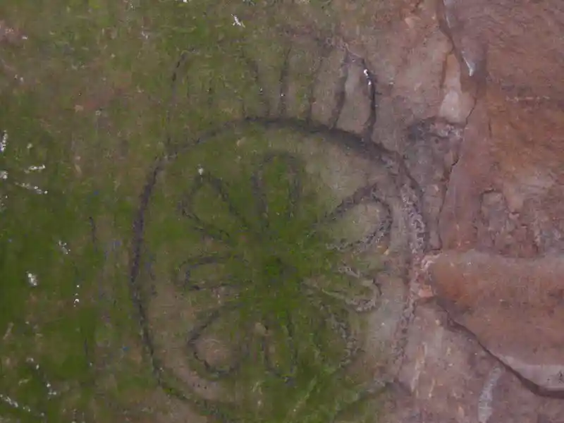 Solar disc on a stone on the grave of Jeremiah